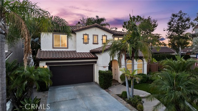 Motivated Seller!!! The wait for your dream home was worth it! Here is a rare opportunity to become a homeowner in this desirable Canyon Oaks neighborhood in Anaheim Hills. It is located at the end of a quiet cul-de-sac where well-maintained homes reflect pride of ownership.  You will be proud to entertain your family and friends in this 4 bedroom, 3 bath, 3095 sq ft executive home. Upon entry, you step into a beautiful foyer that leads to a combination formal living / dining room. The heart of the home is the spacious family room and kitchen. Windows throughout make this space bright and inviting. The family room has a lovely fireplace that warms the home on cool nights. There is also a custom entertainment center with surround sound – perfect for hosting movie nights or holiday parties! The adjacent kitchen makes grabbing snacks easy and is large enough for more than one chef in the family. The rest of the family can gather around the granite island! Sliding glass doors from the kitchen to backyard encourage indoor / outdoor living. Both front and back yards have been professionally landscaped with custom stone and planters full of beautiful plants including lemon and lime trees. The back yard is large enough for a pool. There are grassy areas for kids of all ages and pets to enjoy. It also has a covered patio and BBQ island ready for year round al fresco dining. This back yard is your own private oasis! Back inside, a downstairs bedroom and full bathroom is perfect for guests or family who prefer the ground level. All other bedrooms are located upstairs. The primary bedroom is a private sanctuary complete with a dual-sided fireplace, large walk-in closet and an en suite bath. Each of the secondary bedrooms have access to the hall bath with private vanity areas. The laundry room includes a utility sink and is conveniently located on the second floor in between the bedrooms. There is dual zoned A/C and a newer water heater with instant hot water pump. The 2 car garage has a large closet perfect for storing holiday decorations. Anaheim Hills has great schools, Canyon Rim Park & Walnut Canyon Reservoir. Also conveniently located near shops & restaurants at Savi Ranch. Easy access to 91 frwy & 241 Toll Road.