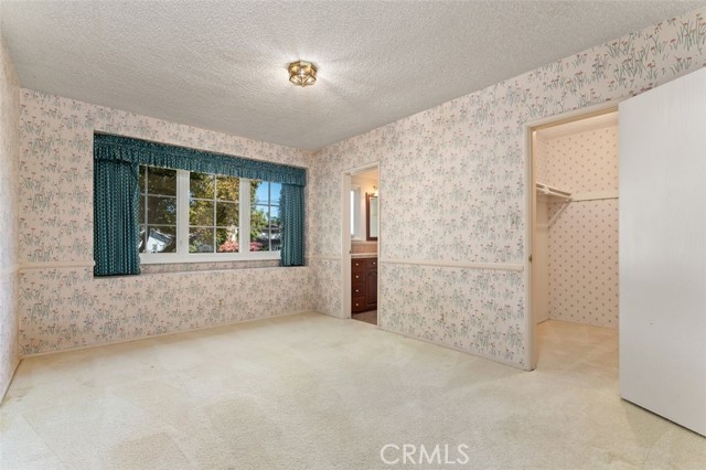 One of the three additional bedrooms with walk-in closet and Jack & Jill bath.