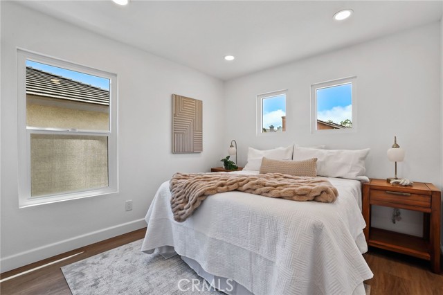 The third bedroom is bright and spacious for a queen size bed.