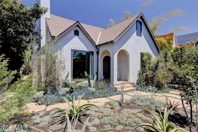 835 Brooks Avenue Venice, California Come view this Hidden Oasis! Explore your own sanctuary located just behind a charming arched entry gate, wander the paths of this private enclave, meander through the fruit trees including kumquat and lemon, and enjoy the striking drought tolerant garden. Completely surrounded by mature landscaping and offering a secluded and gated compound for the discerning few, this remodeled home is a true gem.
In the main home, enter through arched doorways to an open, carefully crafted design featuring soaring ceilings, fine honed hardwoods, exquisite cabinetry, warm woods throughout and understated elegance at every turn. Generous dining room or great room opens to the rear yard with fountains and fruit trees. All interiors were redone in 2018 and include solid, wide plank 3/4" oak floors, custom Chestnut doors, American Chestnut dining room hutch, and Custom cabinetry throughout. Also newly built in 2018 is the rear building housing the two car garage as well as the one bedroom ADU. New heating, Air Conditioning, alarm system, and new custom double glazed Duratherm windows.
On the first floor the front bedroom is a charming guest room or office with views of the enclosed front garden and paths. Upstairs features the primary bedroom with a Juliette balcony including views of the rear yard and guest house. Two additional bedrooms on this second floor, a total of 4 bedrooms in the main home and one bedroom in the guest home.
Wonderful secure parking with a two car garage plus a gated off street parking for two additional vehicles. Upstairs above the garage is a spacious one bedroom ADU, plus living area and dine in kitchen - all overlooking the garden.