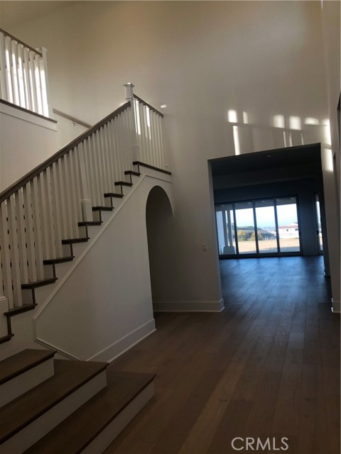 Two story entrance from front door shows the views out the back of the home.