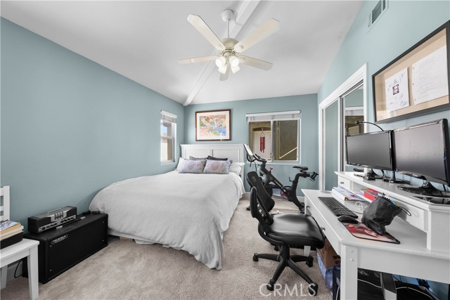 3rd Bedroom with vaulted ceilings and fan