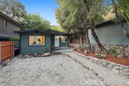765 Woodland Drive Sierra Madre, California Beautiful 2 bedroom 2 bath home has been completely remodeled and redesigned with modern touches all while maintaining its true cabin feel. As you walk in you are greeted by a light filled living room, free flowing in to the updated kitchen giving this home a fantastic open feel. The kitchen updated with all new custom cabinets and a dining area with direct access to the side yard. The master bedroom ample in size, offers custom closet, and master bathroom with designer finishes. A detached one car garage is a great flex space that can be used as a home office or artist studio. The property offers an additional 3 off street parking spots, a huge bonus in this part of the canyon.