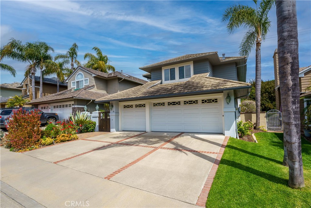 Welcome to this highly upgraded Summerwalk home, featuring the largest floorplan in the neighborhood. This beautiful home offers four spacious bedrooms, three full bathrooms, two large added lofts and a 3 car garage. The list of valuable upgrades is extensive (be sure to check out the list, floor plan, and Matterport walk-through tour). Nestled on a long cul-de-sac street, this home is surrounded by lush greenery below the Colinas Trail.
The exceptional open-concept floor plan is ideal for spacious living and entertaining. Wonderful natural light pours thru the numerous high windows on all sides all day long! The custom-designed wrap-around backyard boasts a custom entry gate, brick pavers, newer white wood French doors, newer large Oak wood sliding glass doors, a BRAND NEW 40-inch blaze barbecue, custom fountain, and beautifully designed vinyl fencing. 
The main floor includes a bedroom with gorgeous windows and plantation shutters, built in closet organizers along side a gorgeous custom-remodeled full bathroom for guests. The kitchen has been extensively remodeled with Custom Shaker style Oak cabinets, DCS gas stainless range & hood, a composite marble sink, and Cambria countertops, breakfast bar & nook eating area. Newer plumbing w/ higher grade copper pipes, PAID SOLAR system, replaced steel roof, dual pane windows (all but 3 replaced), hot water recirculating system, and great exterior Tex-Cote paint. Upstairs offers an amazing floorplan w/ two secondary bedrooms (one is very large), a over-sized secondary bathroom, PLUS an added office/media loft and an added library/desk loft. The primary bedroom, located on the opposite end of the home, features numerous beautiful windows with serene views and nice custom window shades. The primary bathroom is also very large with replaced vanity, counters, lighting, a separate shower & large soaking tub, and customized walk-in closet! This home has been meticulously cared. The Laguna Heights community is surrounded by the Colinas Trail, perfect for walking, biking, & dog walks, with panoramic views of the ocean and San Juan Capistrano below. An additional paved trail in front of the Summerwalk track leads directly to Salt Creek Beach, offering convenient access to the sand without crossing a street. The Dana Point Harbor is just four miles away, providing fun, year-round activities. Laguna Beach is about an 8 minute drive. This home is truly part of a close-knit community with unbeatable lifestyle offerings.
