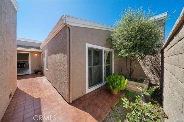 Looking from the gate towards the front door. The courtyard provides an additional private outdoor space.
