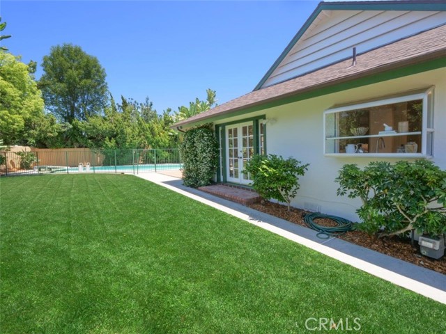 Start the tour around the outside of the house from the kitchen garden window, to the French doors of the family room to the pool.