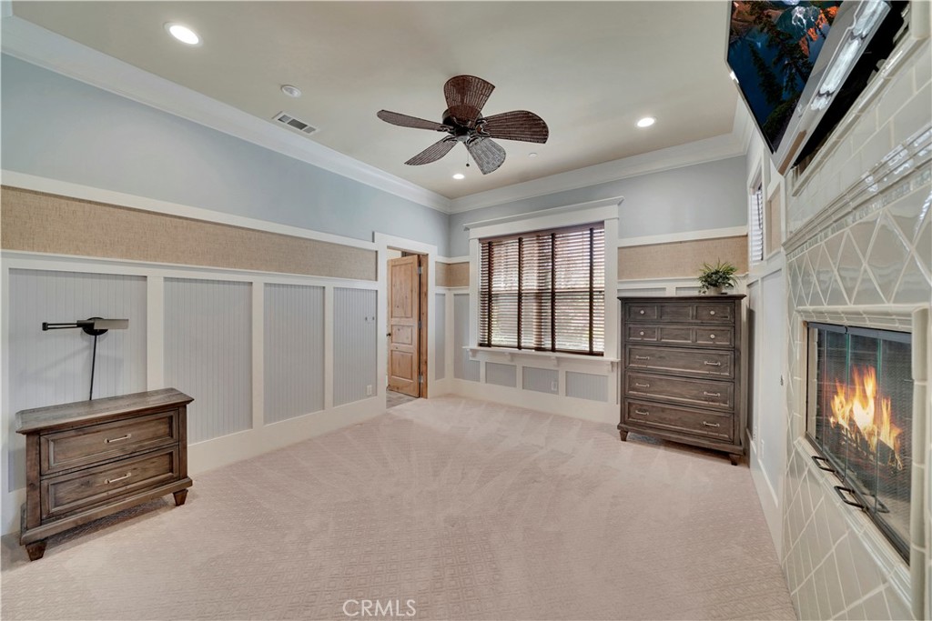 another view of upstairs secondary bedroom with fireplace