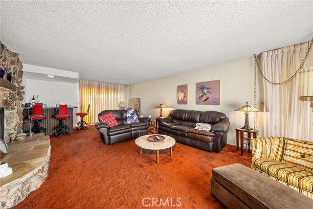 Main unit living room with fireplace and bar area