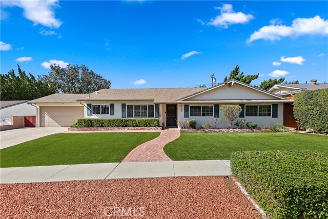 Front of Home - Mature manicured landscaping graces the front of the home.