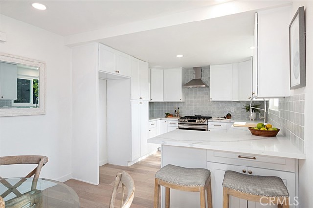 The view of the kitchen from the dining room.