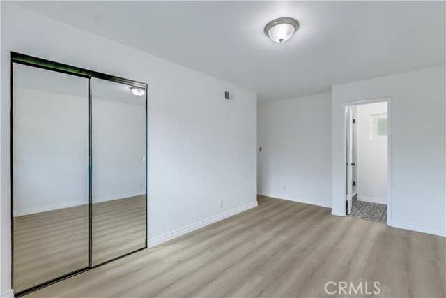 Bedroom 3 w/New Laminate Flooring / New Mirror Closet Sliding Doors.