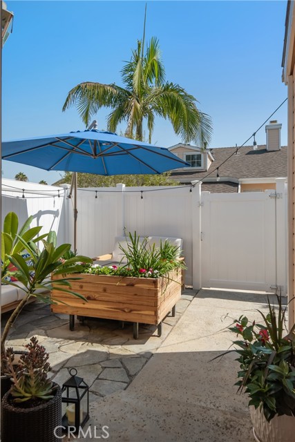 Custom-built planter box and fire pit can stay for your future enjoyment