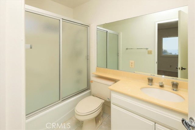 Third bathroom with combo shower/tub.