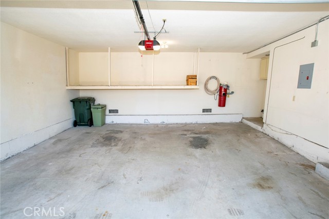 2-Car, direct access garage w/electric opener, storage shelves, built-in vacuum system & full size hook-ups for Washer & Dryer