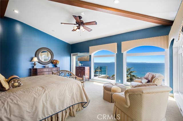 Crowning an expansive two-parcel homesite, the residence pampers owners with a luxe primary suite that welcomes unparalleled ocean and city views, custom walk-in closet, a freestanding tub for the ultimate in relaxation, and access to the deck.
