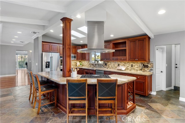The great room is a highlight to the home with a beautifully updated entertainers kitchen featuring an expansive island that is a welcoming focal point to the home.