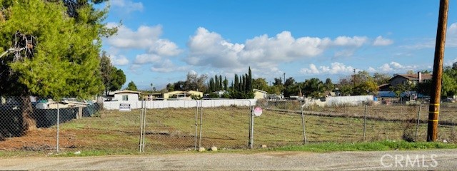 Fenced, light post in front of property