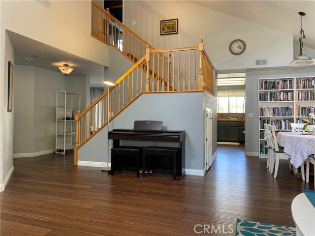 The min living area has high ceilings and luxury laminate flooring.