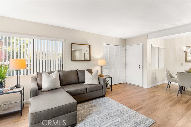 Lovely living room with smooth ceilings, new blinds throughout, new flooring and new paint.