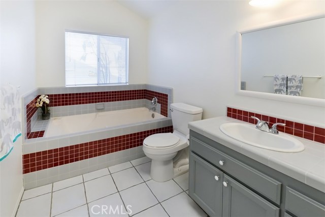 View of the en suite master bathroom.  There is a spa tub and separate shower as well as two sinks.