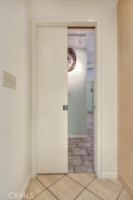 Concealed Pocket Door Separates Kitchen From Dining Room