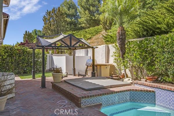 There is a bar-be-que area and also a hot tub next to the pool