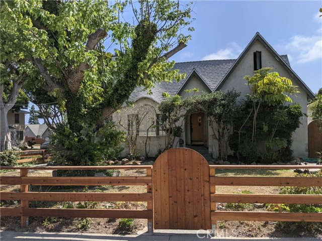 2460 Euclid Street Santa Monica, California Gorgeous English Tudor home in Sunset Park. Lush landscape with musical feel of wind chimes and characteristic trees. This house is preserved to its original charm with a fireplace in living room. Bright and airy. Updated wood floors and windows. Updated bathroom; updated electrical and copper plumbing; reinforced foundation and recently replaced roof; beautiful new redwood fence. An over-sized finished attic space can be used as a large master bedroom suite with ample room to use. Renovated gourmet Kitchen opens to an enchanting large back garden of countless kinds of flowers with eating area, fire pit and ground level trampoline. Newly paved drive-way parking space with L2 electric vehicle charger. Carriage house/garage in the backyard used as an extra studio ADU (structure modification permitted). Loads of privacy in this fantastic corner lot. Within 5min walk to Santa Monica College and 15min walk to downtown Main St and the beach. Come and see to appreciate. By appointment only.