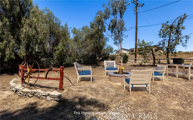 Area West of Home Staged Barbecue and Fire Pit Area