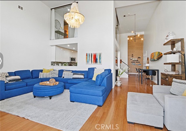 Living room with loft or game room upstairs