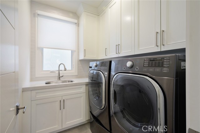 laundry room located at the top of stairs