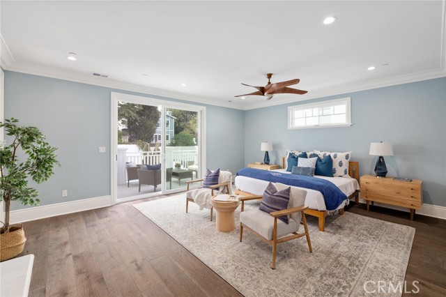 Grand Master Suite with Balcony Overlooking the Backyard Oasis