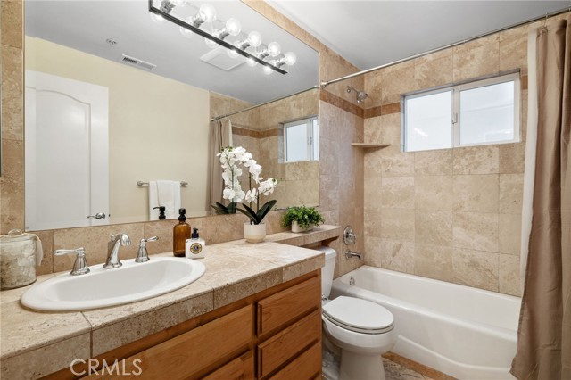 Full Bath on main level has new plumbing fixtures, toilet and accessories.