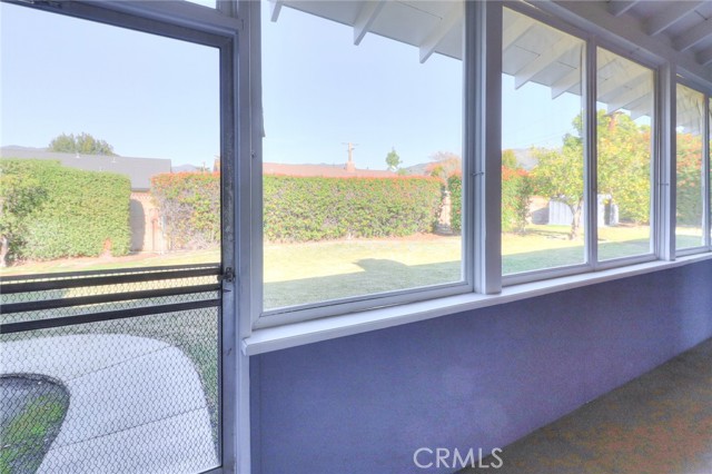 Screen in porch with a view to the back yard.