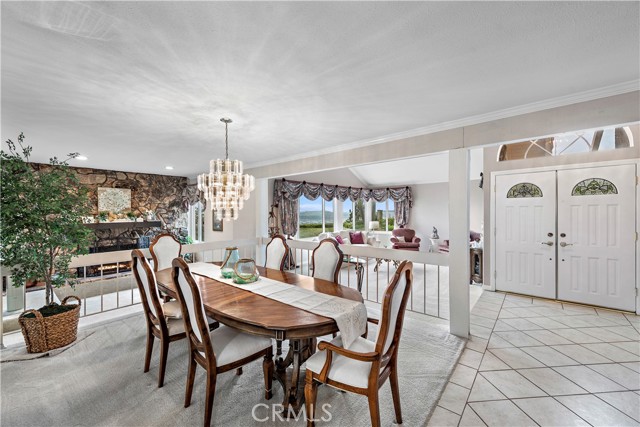 Beautiful formal dining off foyer, formal living & conversation nook.