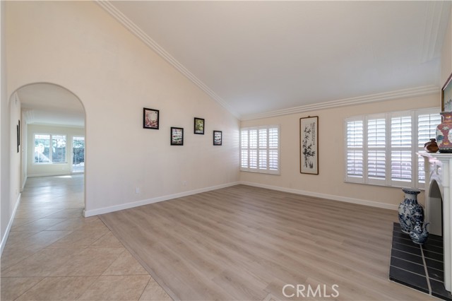 Living Room- new waterproof vinyl prank floorings, plantation shutters, custom crown molding