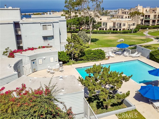 240 The Village 311 Redondo Beach, California PANORAMIC OCEAN VIEW PENTHOUSE. GREAT PRIVATE LOCATION CORNER END UNIT NESTLED IN THE LUSHLY LANDSCAPED GROUNDS. Beautifully appointed interior expands to a spacious deck overlooking the Ocean. The upstairs loft/bedroom and bath with amazing breathtaking Ocean, Harbor, and Sunsets Views. Meticulous attention to detail and pride of ownership throughout this two-story condo with views from every room. LIVE THE DREAM AT "SEASCAPE ONE" with the resort-like atmosphere. Prime location adjacent to The Water Front. Walk to shopping & restaurants or take a bike cruise along the beach on the world famous strand. HOA amenities: heated pool, spa & dry sauna is overlooking the Pacific Ocean. Features included: Top floor rare open floor plan~High Vaulted Ceilings~Dual Pane tinted windows~ French doors to the downstairs Bedroom~ Wood burning fireplace ~ tiled flooring in the kitchen, bathrooms, and entry. Remodeled kitchen with Breakfast Bar open to living room & formal dining. The floor plan is laid out with a bedroom and bathroom on each floor and an additional dining room or den on the lower level.| Fireplace | Spacious Balcony | Walk-in closets on both floors and additional storage space | 2 Car side by side parking #22, #23 in A Garage Storage located in front of parking. | freshly Painted interior & newly installed designers carpeting | Laundry near the elevator | Refrigerator, cook top, stove, microwave, garbage disposal, Utilities include gas, water, trash, sewer.