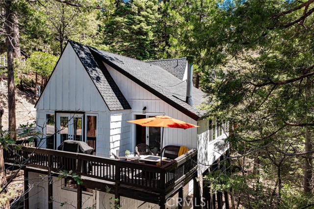 Deck is surrounded by beautiful trees