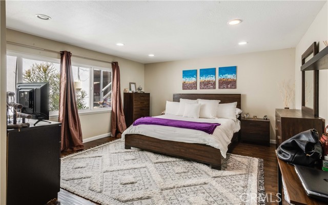 Currently the primary bedroom.This room was the downstairs den and is now being used as a fourth bedroom.