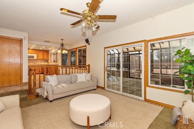 FAMILY ROOM LEADING TO ENCLOSED PATIO