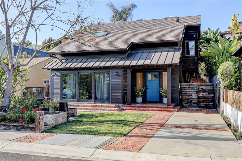 Located on one of the BEST blocks on one of the BEST streets in the MB Tree Section this classic 4 bedroom and 4 bath family is home filled with character, charm, and a great vibe...
Affectionately nicknamed 'Tahoe at the Beach in the Trees', 713 29th is definitely not your typical Tree Section home.
The MAIN HOUSE has 2,209 sq ft of living space with 3 bedrooms and 3 baths along with 2 living rooms, both opening to great outdoor spaces. The primary bedroom suite also has an enclosed sunroom that would be perfect for an office or gym. The other two bedrooms each have cool and functional sleeping lofts that give the bedrooms more hanging-out space for the kids. The garage is in the rear of the property which allowed a separate, permitted living space to be added. The approx. 650 sq ft living space/4th bedroom with 3/4 bathroom above the garage can also be used as a great guest suite with a large sleeping loft, amazing office space, hang out bonus room, or all of the above! The backyard area is a highlight of the property. It perfectly utilizes all of the 4,800 sq ft lot as the current residents enjoy a spa, outdoor shower, dining area, large yard/patio area, and sports court. The possibilities are intriguing, the location is A+ and the home is ready for you to step in and make your own.
Note: Main home 3 bed, 3 bath, 2,200 sq ft and permitted unit above garage is approx 600 sq ft and 1 bed/1bath.