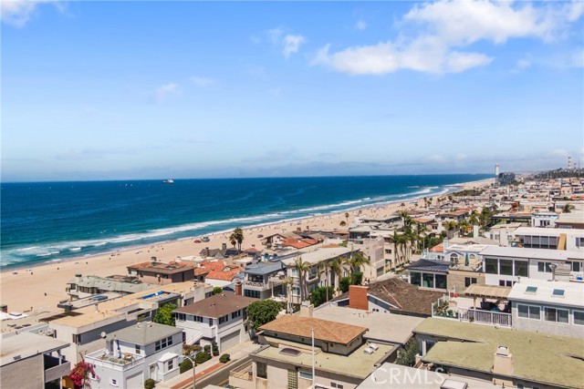 Panoramic sand & white water ocean views