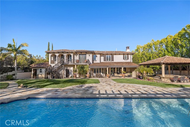 Looking across the pool to the back of the house.
