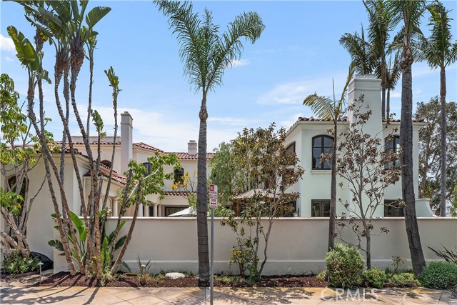 401 Piazza Lido Newport Beach, California This stunning villa on Lido Island features five bedrooms and six bathrooms. The property includes five fireplaces, a four-car garage, an elevator, and it is situated on a corner lot. This custom-built home has a 45-foot lap pool, jacuzzi, and a butler's pantry. This property is approximately 5,000 square feet on a 6,000 square foot lot. The primary bedroom suite offers an abundance of space, with ample room for a seating area. The en-suite bathroom features dual vanities, a soaking tub, and a separate shower. Includes a large walk-in closet. Three additional bedrooms provide comfortable accommodations for guests or family members, while a separate maid’s room offers added convenience. The home's four-car garage offers generous storage and parking space. The elevator provides convenient access to both levels of the home. The property's corner lot location allows for abundant natural light and a sense of privacy. The custom design of the home includes thoughtful architectural details and high-end finishes throughout. The 45-foot lap pool is an ideal amenity for those who enjoy swimming or exercise. The butler's pantry provides an oven and wet bar with an additional storage and preparation space, making it convenient for entertaining.