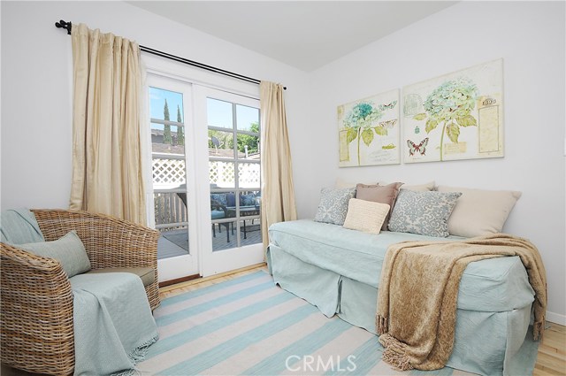 Bedroom with sliding door open to a deck for relaxation