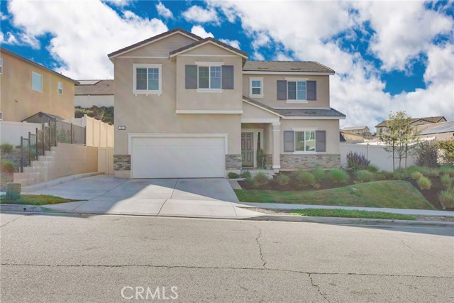 265 Country Club Drive Calimesa, California ENTERTAINERS DREAM! Practically new 5 bed/3 full bath home with large downstairs master suite. Spacious great room opens up to backyard paradise of covered patio with TV mount, fans, lighting, golfers delight putting green with four holes, fire pit area and green grass for happy pets or kids. Upstairs has open bonus/family room area before hall way to the 3 upstairs bedrooms and full bathroom. Fully wired house for security and internet systems. Drip system for flower/garden beds. This gated community has pools, parks, clubhouse, walking trails, sport court, several community events and its own Facebook page. Call your agent about the special offer from the seller!