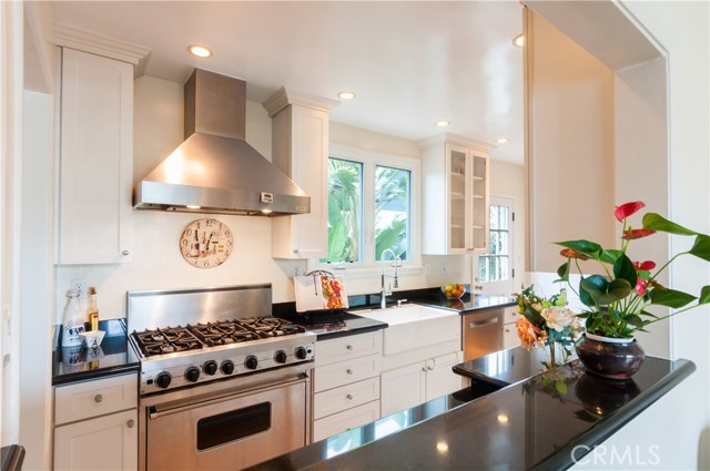 Stainless Steel Appliances Including a Viking Range, Bosch Dishwasher, Sub-Zero Refrigerator, Plus a Separate Wine Fridge.