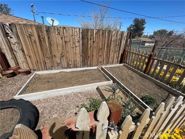 Fenced area for your vegetable garden or flower beds.