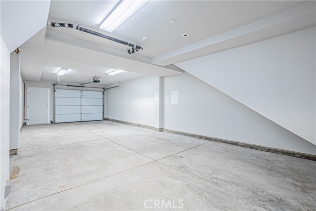 Tandem Garage with access to multi-use room.