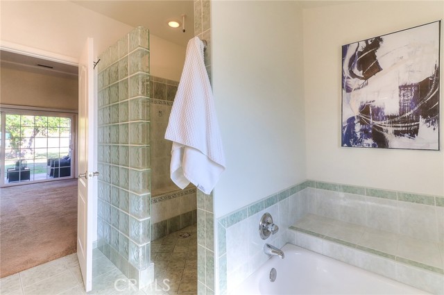 Separate bathtub and a large stepless shower.