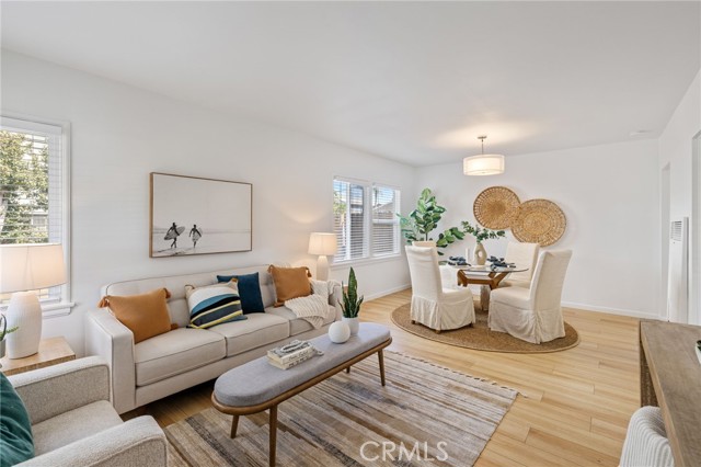 Enter into your living room with view toward your dining area.